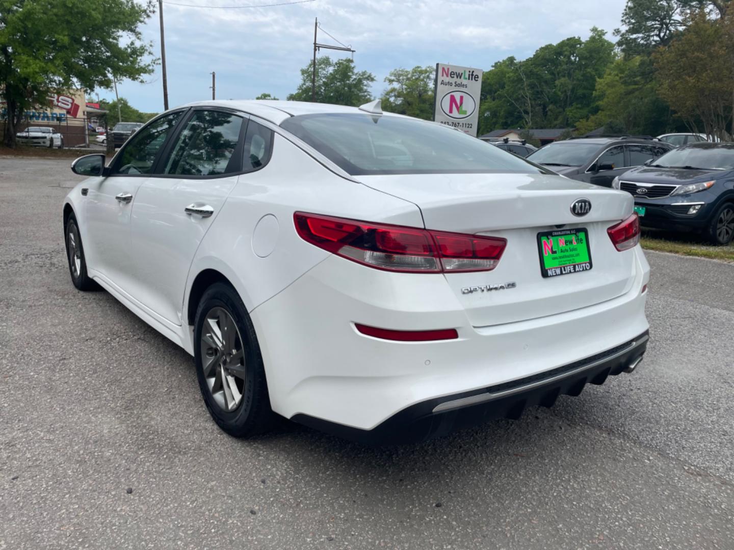 2019 WHITE KIA OPTIMA LX (5XXGT4L38KG) with an 2.4L engine, Automatic transmission, located at 5103 Dorchester Rd., Charleston, SC, 29418-5607, (843) 767-1122, 36.245171, -115.228050 - Spacious interior with AUX/USB/Bluetooth, Backup Camera, Power Windows, Power Locks, Power Mirrors, Keyless Entry, Alloy Wheels. Local Trade-in! 124k miles Located at New Life Auto Sales! 2023 WINNER for Post & Courier's Charleston's Choice Pre-owned Car Dealer AND 2018-2024 Top 5 Finalist for Char - Photo#4